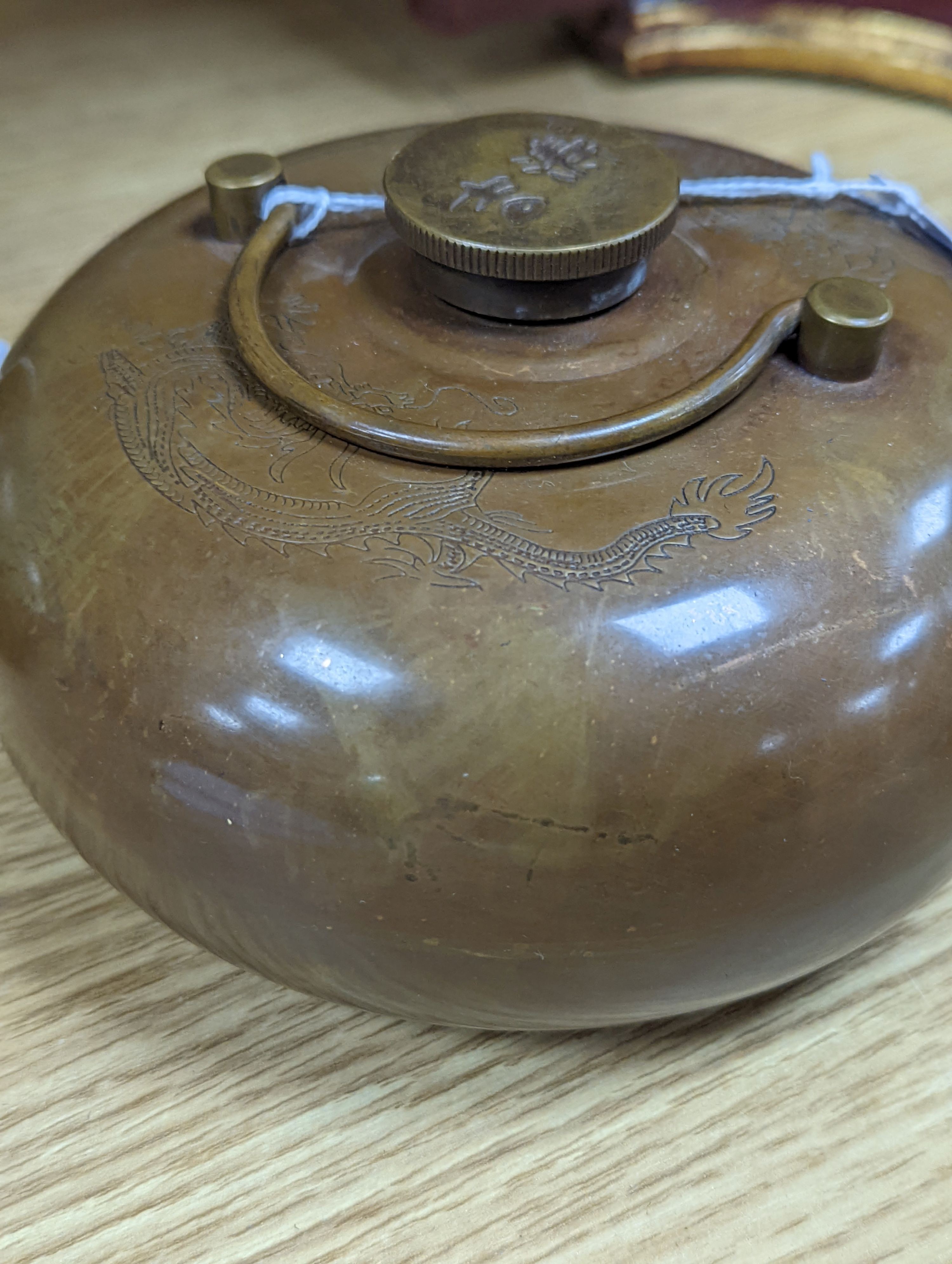 Two Chinese bronze handwarmers and a turquoise glazed jar